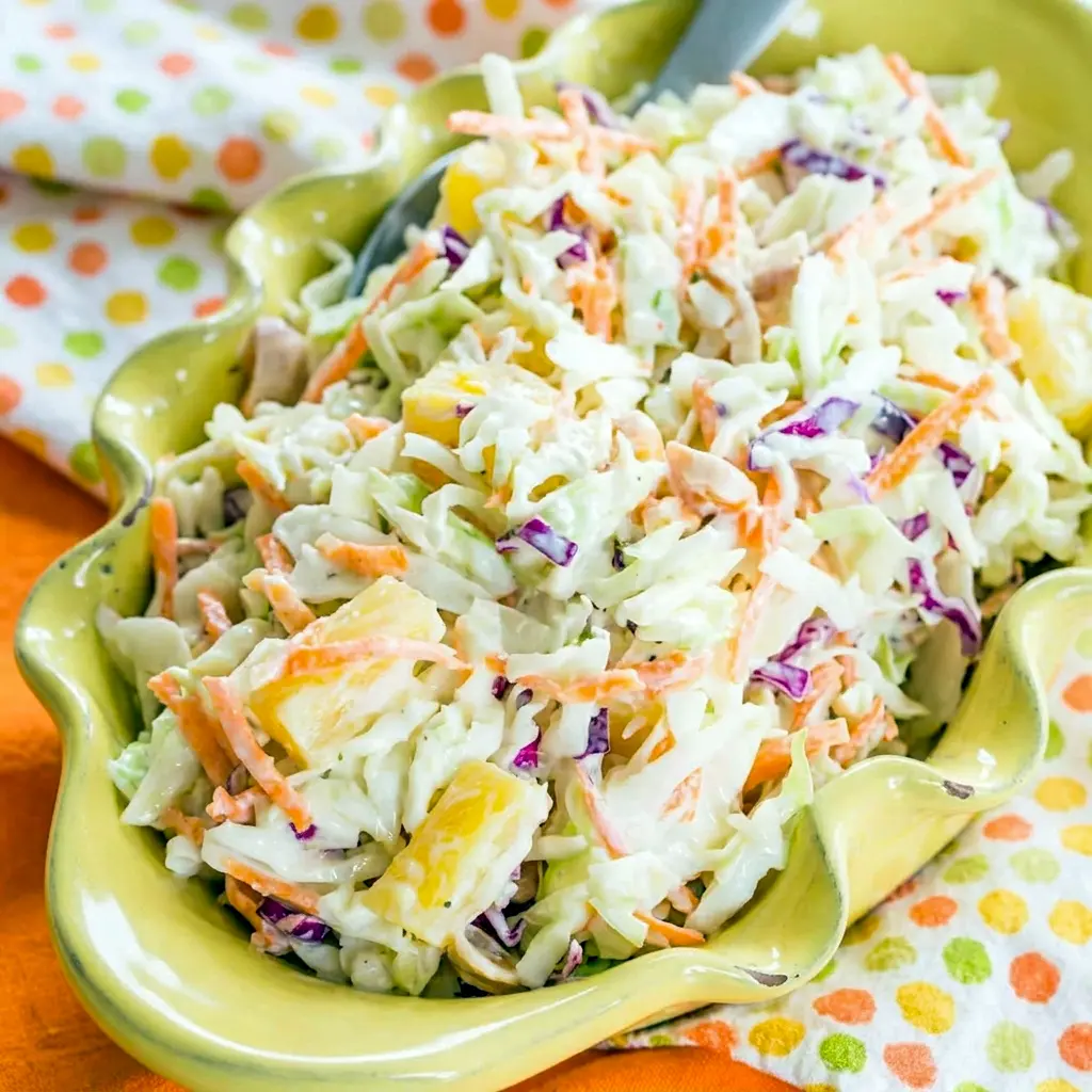 Colorful Hawaiian Pineapple Coleslaw with pineapple and macadamia nuts, a refreshing Pineapple Coleslaw No Mayo recipe.