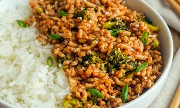 Firecracker Ground Chicken Bowl for Light Family Dinners, served in a colorful skillet with broccoli and a sweet-spicy sauce.