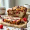 Raspberry Dark Chocolate Banana Bread sliced on a plate, a rich Chocolate Raspberry Bread for cozy snack time.