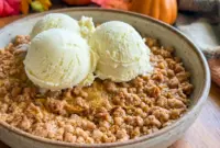 A warm Pumpkin Crisp topped with golden streusel, one of the best Things To Bake Thanksgiving for a cozy holiday dessert table.